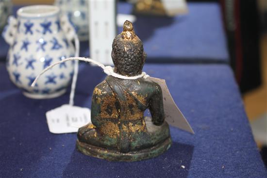 A 17th century Chinese gilded bronze Buddha H.10.5cm